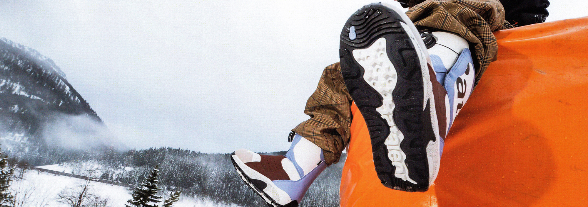 Women's snowboard boots being displayed